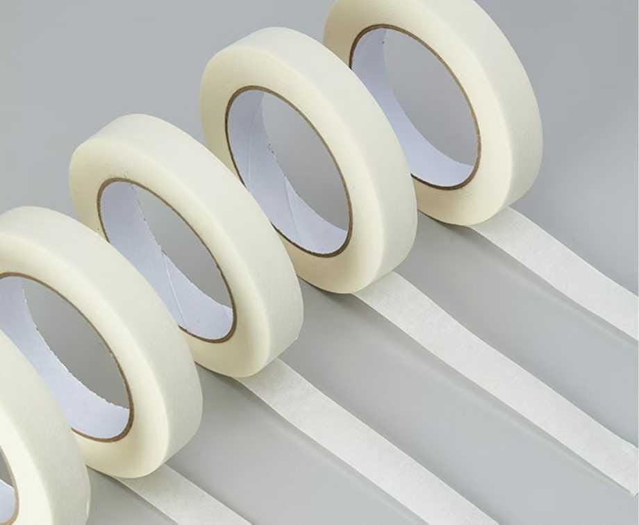 Masking tape unrolled to show the paper backing